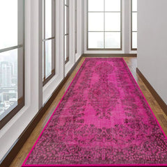 Close-up of the Vibrant Pink Rug’s bright color and low-profile pile.